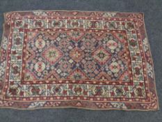 A needlework Sumak kilim 133cm by 87cm