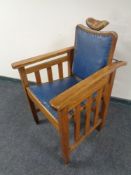 A 1920s oak adjustable barber's chair supplied by The Hairdresser's Salon Fitting Supplies