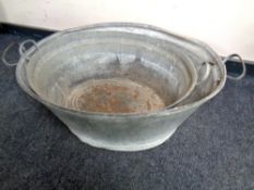 Two 20th century galvanized metal wash tubs,