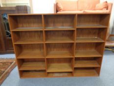 A set of mid 20th century Danish teak effect open bookshelves,