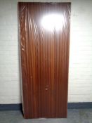 An interior door in a teak finish, height 205 cm,