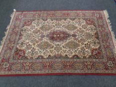 A machine made rug of Persian design,