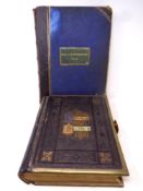A 19th century leather and brass bound holy bible with colour book plates together with a further