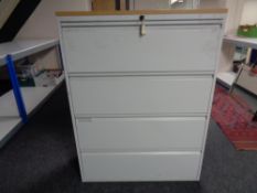 A four drawer metal document cabinet
