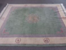 A Chinese carpet on green ground