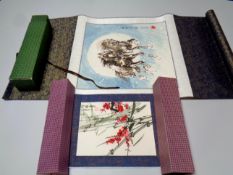 Two rolled Japanese prints in boxes,