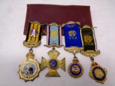 Three silver RAOB badges on ribbons together with a further badge and a leather pouch