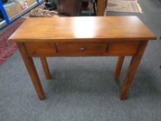 A contemporary console table fitted a drawer