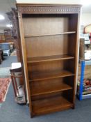 A set of contemporary oak open bookshelves