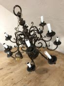 A continental brass twelve branch chandelier