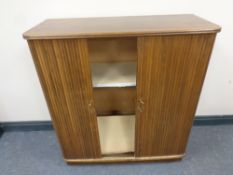 A mid 20th century double door shutter cabinet, width 97.