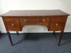 A 19th century mahogany sideboard on raised legs