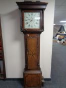 An early 19th century inlaid oak eight day longcase clock,