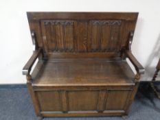 An oak storage monk's bench