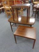 A 20th century extending coffee table in a walnut finish together with a Danish Haslev rosewood