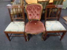 A French gilt dressing table chair upholstered in a pink button dralon together with a further pair