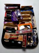 A tray containing a quantity of boxed die cast cars to include Lledo and Corgi,