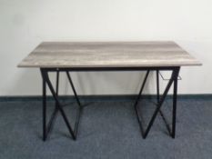 A contemporary computer table on metal legs