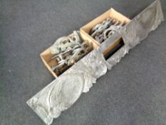 Two boxes containing a quantity of bespoke metal door handles together with a further metal door