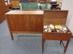 A mid 20th century teak double door shutter cabinet,