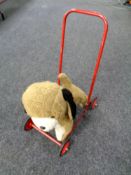 A mid 20th century Hygienic Toys push along dog