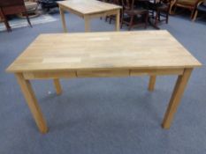 A contemporary oak office table fitted three drawers,