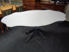 A shabby chic Italian style pedestal dining table