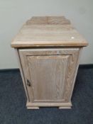 A washed pine effect pot cupboard