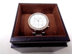 A Michael Kors lady's chronograph and date function watch with box and instructions