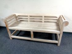 A Lindsey plantation teak scroll arm bench, length 160 cm.