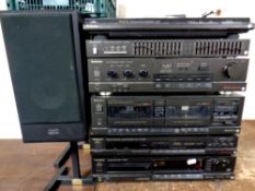 A six piece Technics separate system with wires together with a pair of speakers on stands