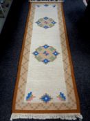 An eastern runner on cream ground,