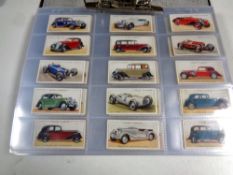 A file of cigarette cards, Coronation, Naval, Dogs,