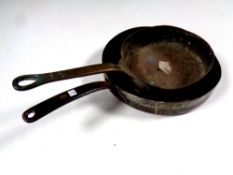 Two early 19th century copper cast iron handled pans