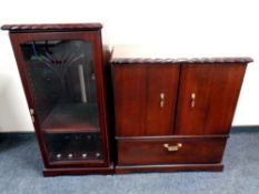 An audio cabinet and TV cabinet in mahogany finish