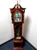 A Tempus Fugit 31 day granddaughter clock with pendulum weight and key
