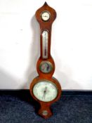 An antique mahogany barometer