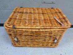 A large wicker laundry hamper