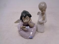 A Lladro figure of a seated cherub with hand bell,