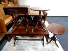 A good quality inlaid mahogany flap sided sofa coffee table on brass capped feet together with a