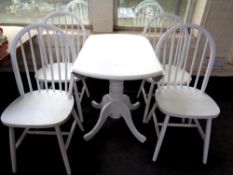 A painted Julian Bowen drop leaf kitchen table and four chairs