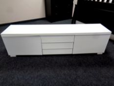 A white gloss entertainment stand,