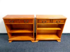A pair of inlaid yew wood open bookshelves fitted two drawers above, width 75.