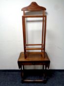 An Edwardian oak flap sided table fitted a drawer together with a mid 20th century valet stand