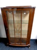 A mid 20th century walnut display cabinet