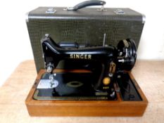A 20th century Singer hand sewing machine in case
