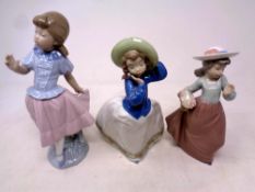 A Nao figure, girl with basket of flowers,