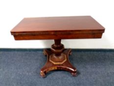 A Victorian mahogany pedestal turnover top tea table