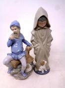 A Nao figure, Pigmy with apple, together with a further Nao figure,