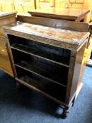 A set of Edwardian carved oak open bookshelves,